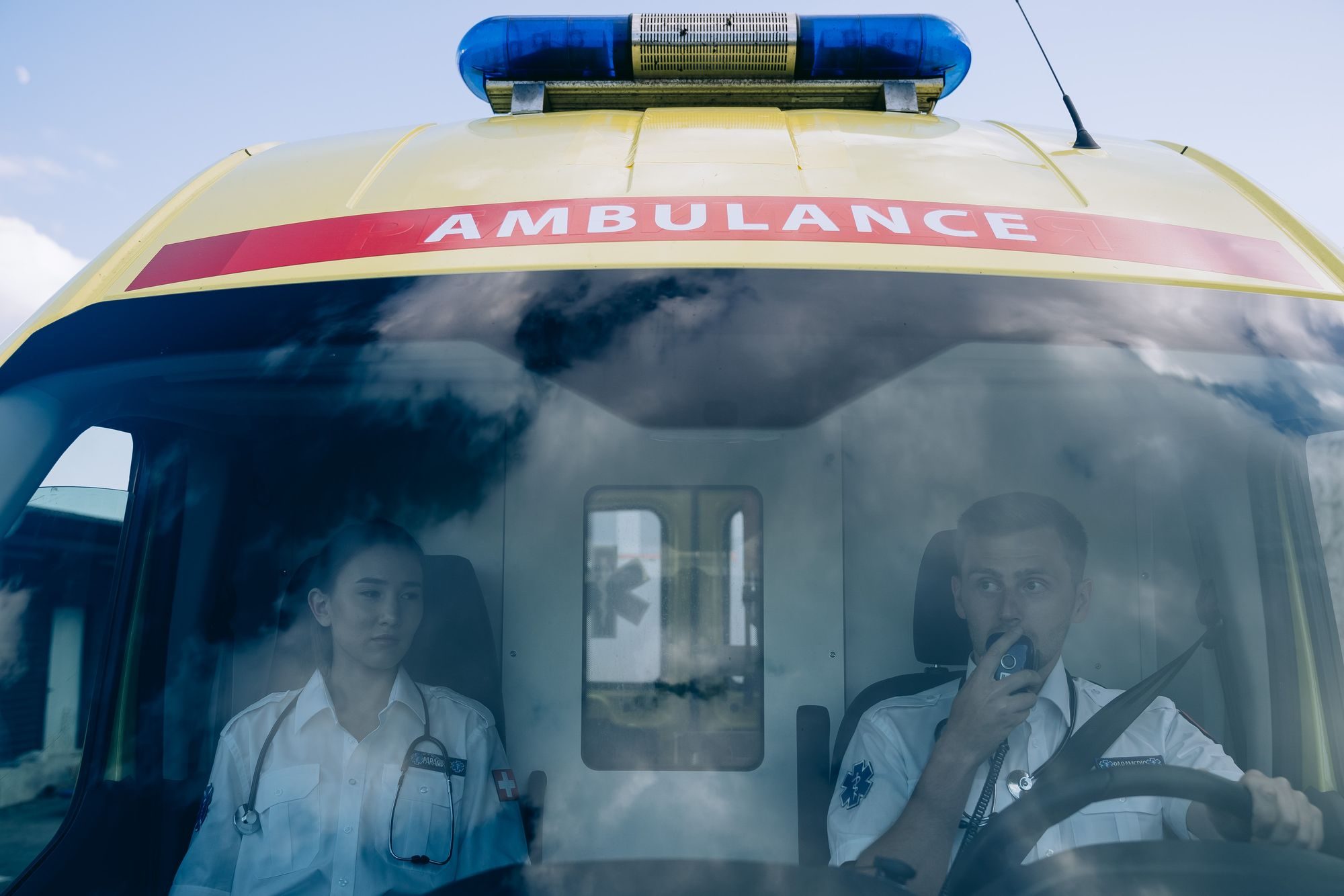 Ambulance crew in the cab of an emergency vehicle