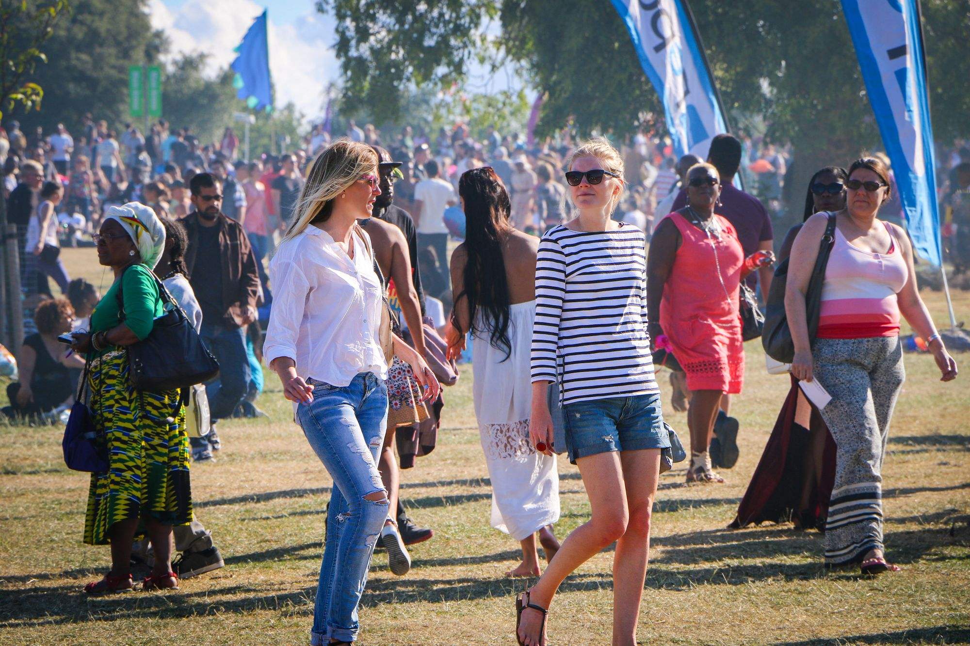 Crowd enjoying an outdoor festival in London on a sunny day
